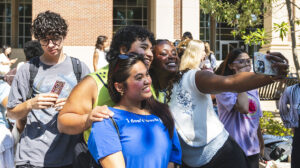 A group of students take a selfie. 