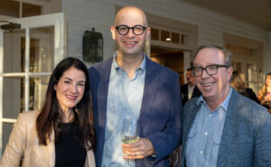 Nikki Neely Davis visits with John T. Edge and Gray Flora. 